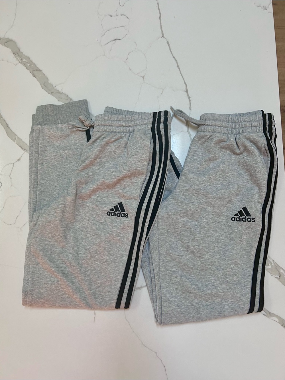 2 pairs Adidas grey sweatpants with stripes. Men Medium.